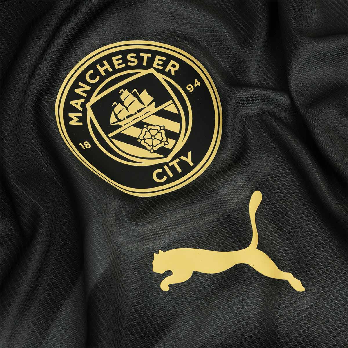 PUMA MANCHESTER CITY 2026/2027 PRE MATCH JERSEY - PUMA BLACK/ARCHIVE GOLD
